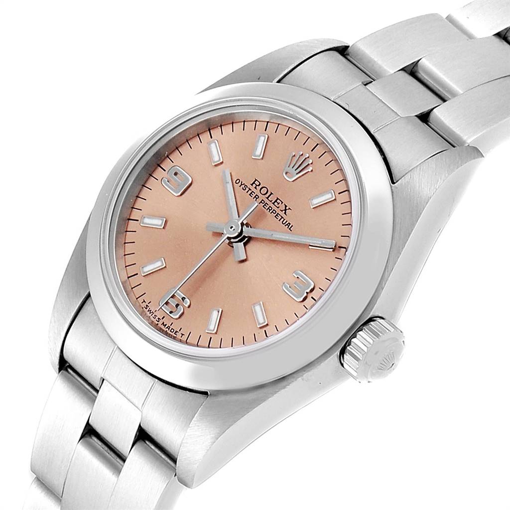 This image shows a Rolex Oyster Perpetual 76080 Women's Stainless Steel Pink Dial 76080 Women's Stainless Steel Pink Dial watch at an angle highlighting its face, crown, and part of the bracelet.