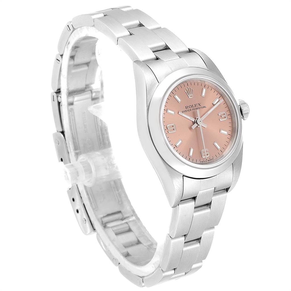 The Rolex Oyster Perpetual 76080 Women's Stainless Steel Pink Dial 76080 Women's Stainless Steel Pink Dial watch is shown at a three-quarter angle, displaying its bracelet, pink dial, case, and crown.