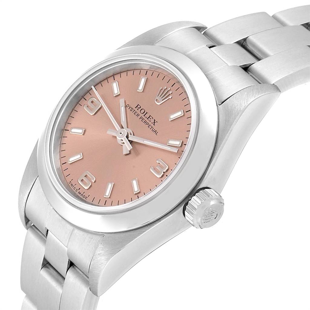 This is a close-up, diagonal angle of the Rolex Oyster Perpetual 76080 Women's Stainless Steel Pink Dial 76080 Women's Stainless Steel Pink Dial watch, showing the dial, case, and part of the bracelet.