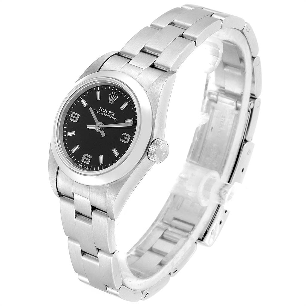 The Rolex Oyster Perpetual 76080 Women's Stainless Steel Black Dial 76080 Women's Stainless Steel Black Dial watch is shown at a slight angle, prominently displaying its face, bezel, crown, and stainless steel bracelet.