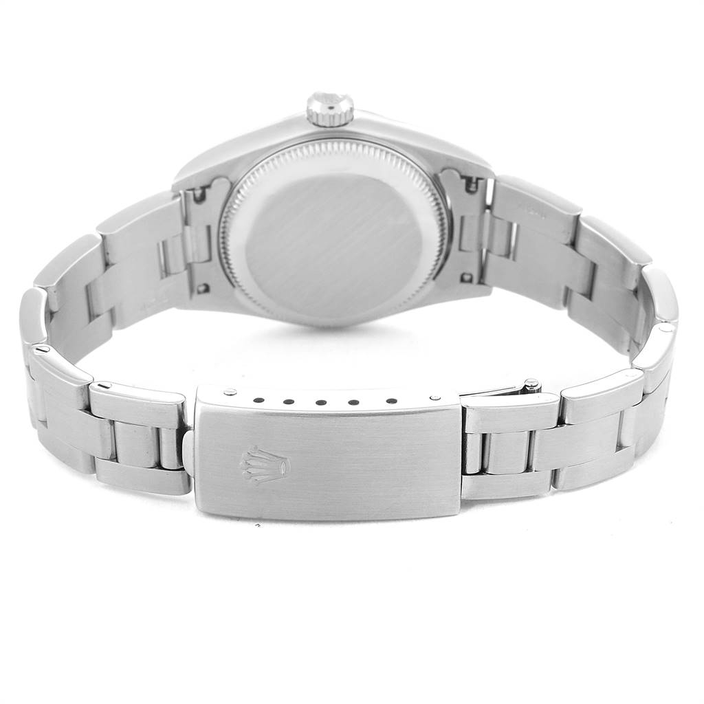 The image shows the back view of a Rolex Oyster Perpetual 76080 Women's Stainless Steel Black Dial 76080 Women's Stainless Steel Black Dial watch, highlighting its case back and clasp.