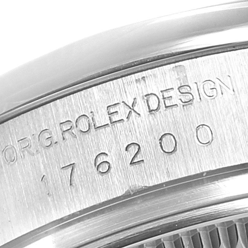 Close-up of the case showing "ORG. ROLEX DESIGN" and model number 176200 on the Rolex Oyster Perpetual 176200 Women's Stainless Steel Blue Dial 176200 Women's Stainless Steel Blue Dial watch.