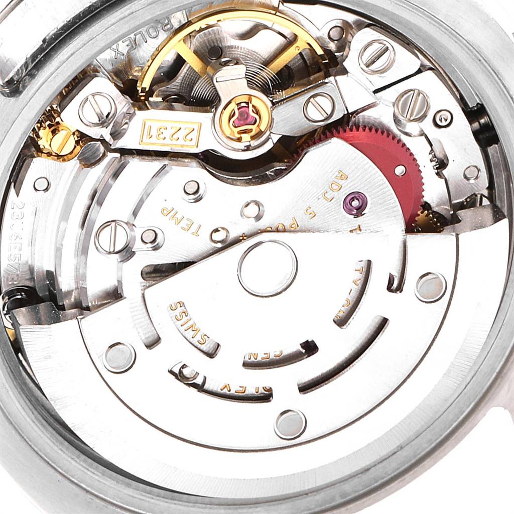 This image shows a close-up view of the intricate internal mechanism of a Rolex Oyster Perpetual 176200 Women's Stainless Steel Blue Dial 176200 Women's Stainless Steel Blue Dial watch.