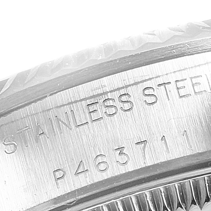 This close-up image shows the engraving on the case back of a Rolex Oyster Perpetual 76094 Women
s Stainless Steel White Dial 76094 Women
s Stainless Steel White Dial watch.