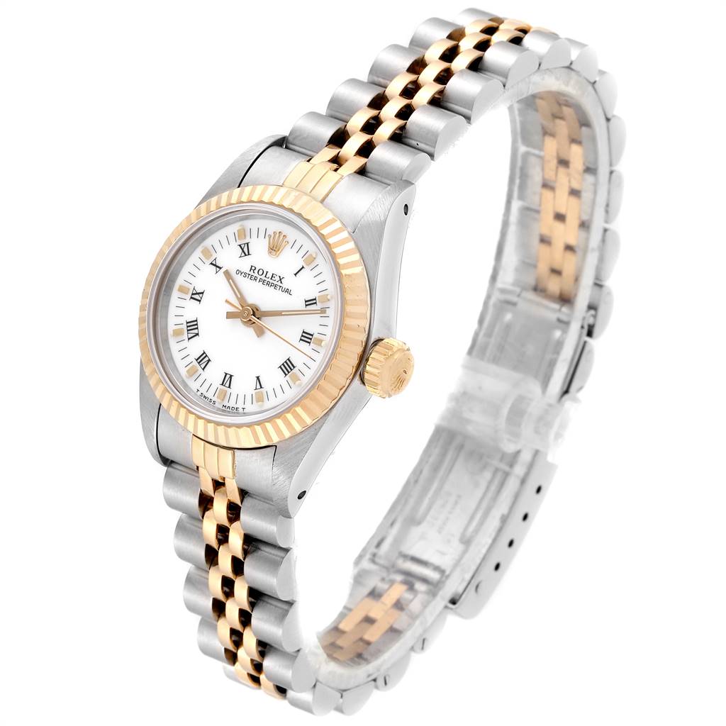 This image shows a Rolex Oyster Perpetual 67193 Women
s Steel and Gold (two tone) White Dial 67193 Women
s Steel and Gold (two tone) White Dial watch at a three-quarter angle, highlighting its case, bezel, bracelet, and crown.