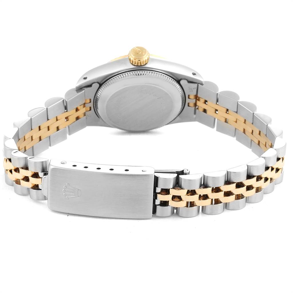 The image shows the back of a Rolex Oyster Perpetual 67193 Women
s Steel and Gold (two tone) White Dial 67193 Women
s Steel and Gold (two tone) White Dial watch, highlighting the backside of the case and two-tone bracelet and clasp.