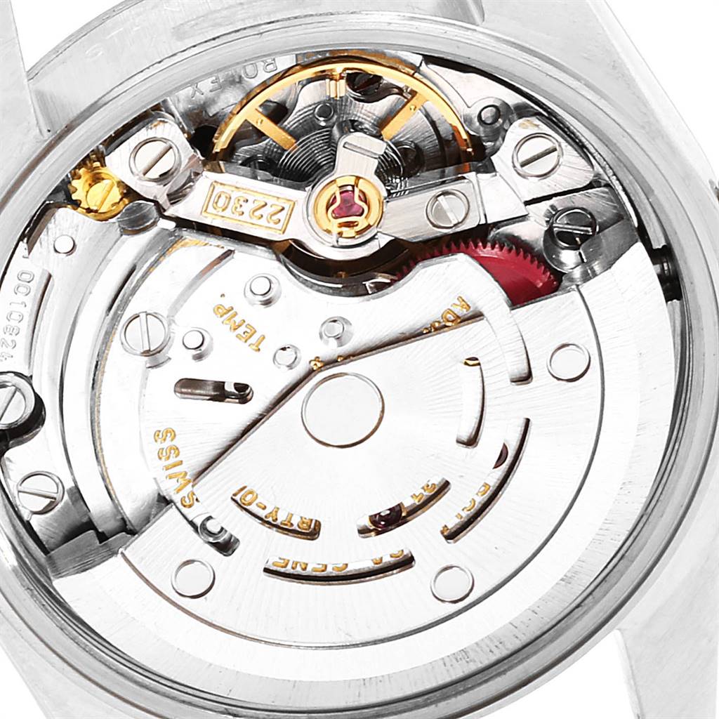 The image shows a close-up view of the movement mechanism of a Rolex Oyster Perpetual 76080 Women's Stainless Steel Black Dial 76080 Women's Stainless Steel Black Dial watch.