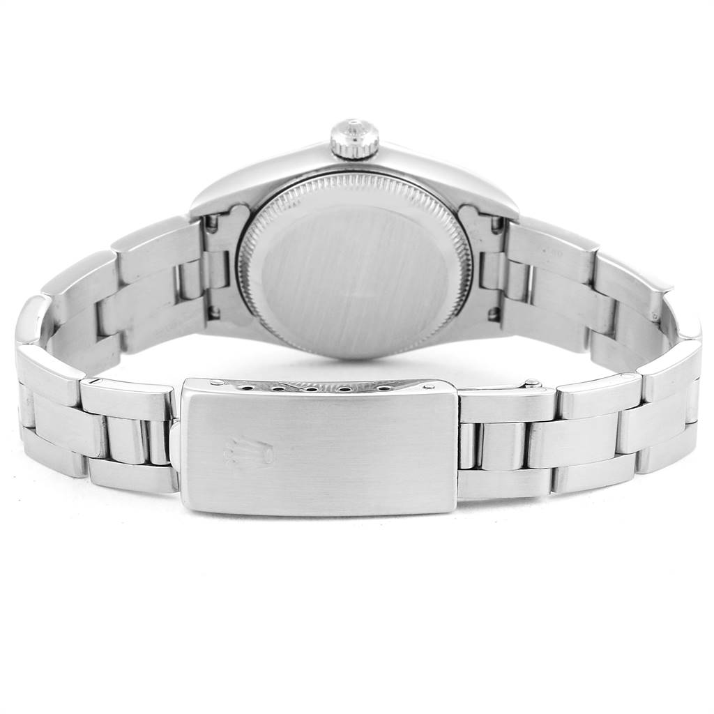 The image shows the back view of a Rolex Oyster Perpetual 76080 Women's Stainless Steel Black Dial 76080 Women's Stainless Steel Black Dial watch, displaying the clasp and case back.