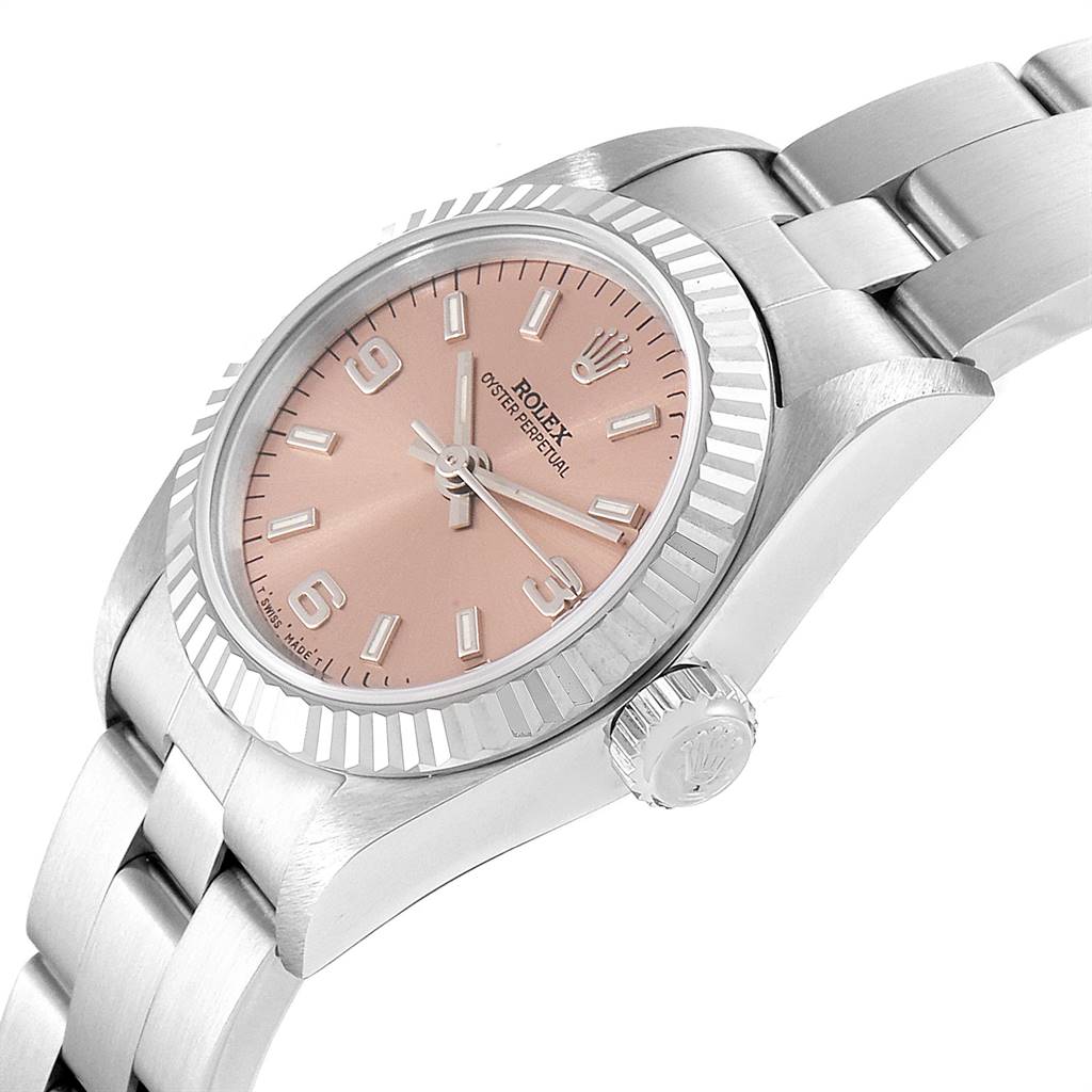 The image shows a Rolex Oyster Perpetual 67194 Women's Stainless Steel Pink Dial 67194 Women's Stainless Steel Pink Dial watch at a slight angle, highlighting the face, bezel, and part of the bracelet.