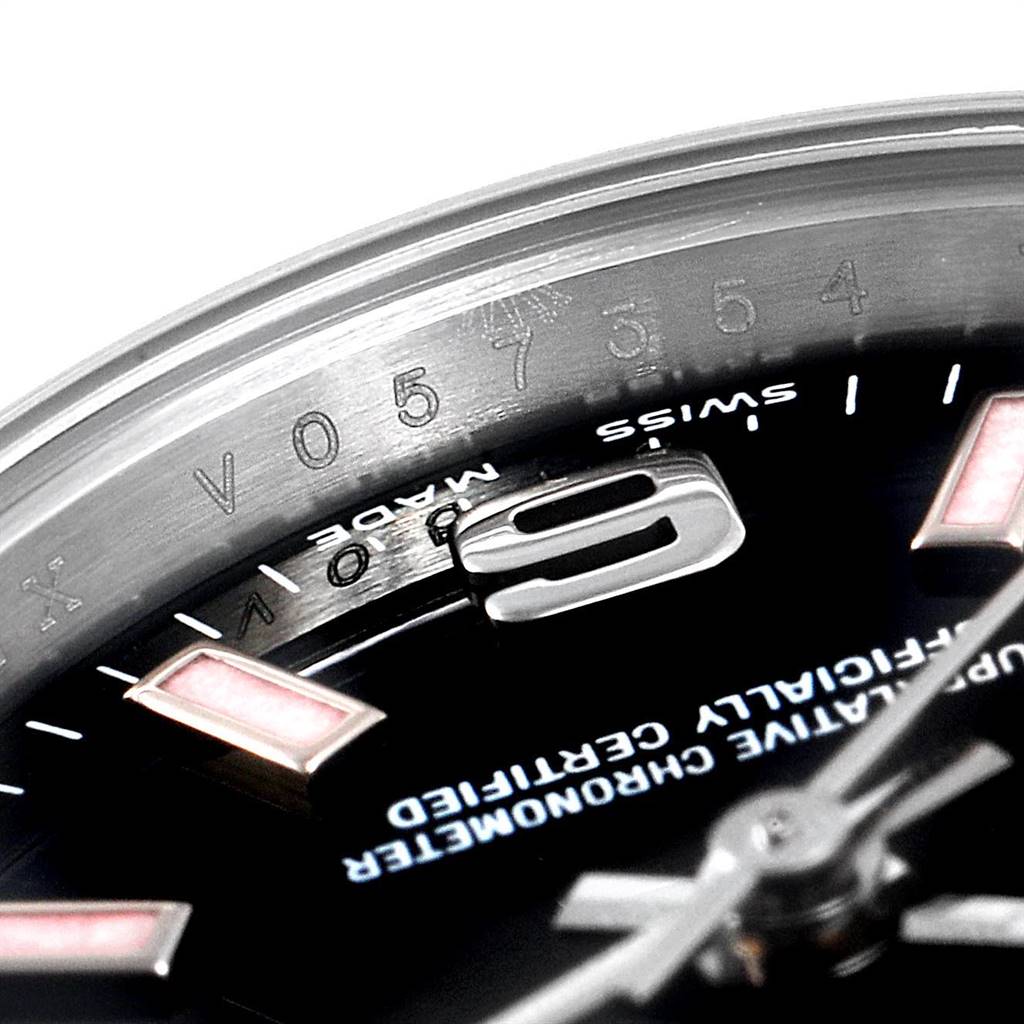 The image shows a close-up of a Rolex Oyster Perpetual 176200 Women's Stainless Steel Black Dial 176200 Women's Stainless Steel Black Dial watch, focusing on the upper part of the dial and rehaut.