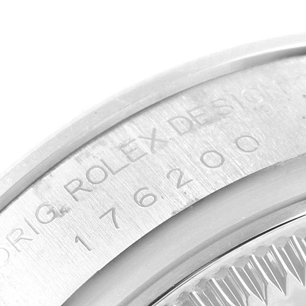 Close-up of the etched Rolex Oyster Perpetual 176200 Women's Stainless Steel Black Dial 176200 Women's Stainless Steel Black Dial model number on the watch case.