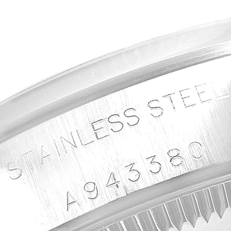 This image shows a close-up of the serial number and "Stainless Steel" engraving on the case back of a Rolex Oyster Perpetual 76080 Women's Stainless Steel Silver Dial 76080 Women's Stainless Steel Silver Dial watch.