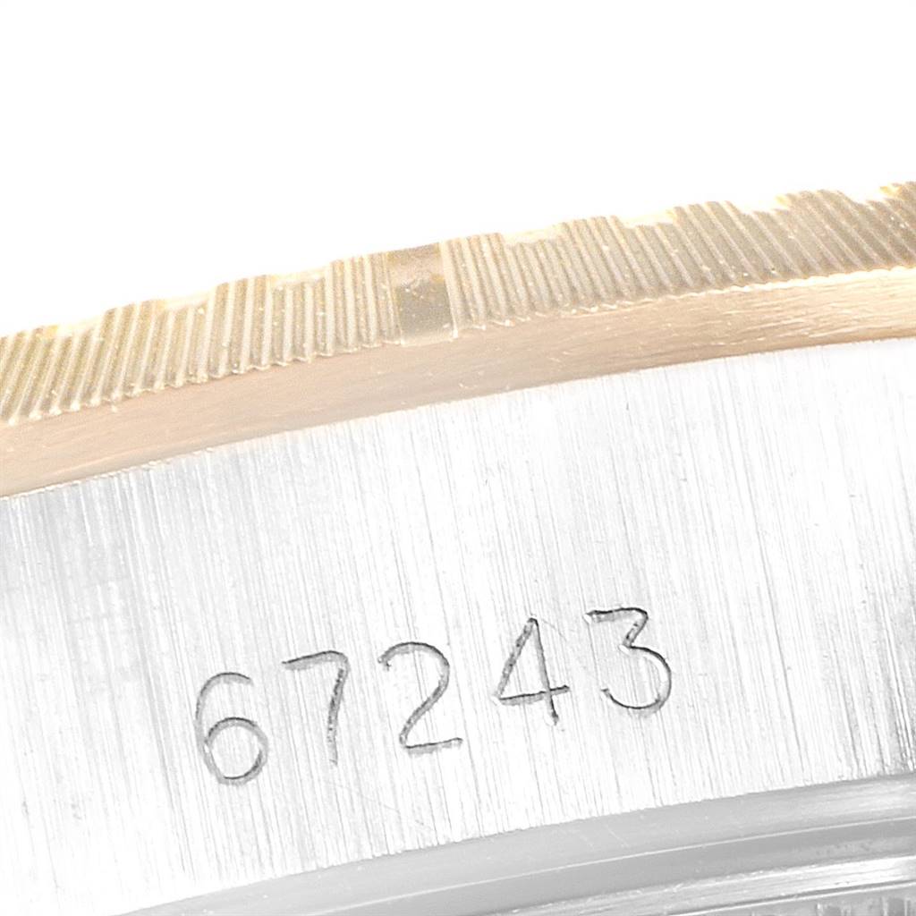 This image shows a close-up of the bezel and case with the model number "67243" on a Rolex Oyster Perpetual 67243 Women
s Steel and Gold (two tone) Champagne Dial 67243 Women
s Steel and Gold (two tone) Champagne Dial watch.