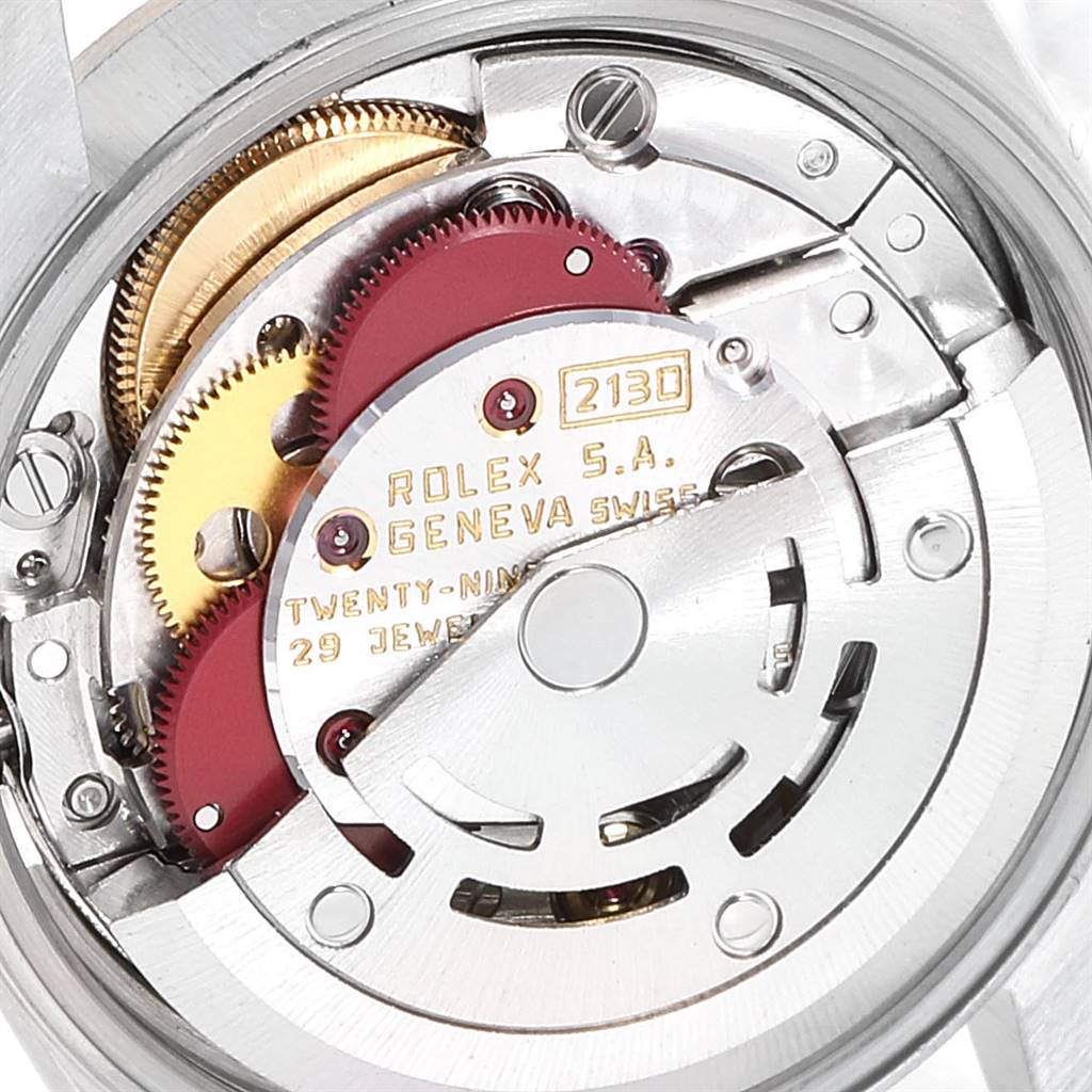This image shows the internal movement of a Rolex Oyster Perpetual 67243 Women
s Steel and Gold (two tone) Champagne Dial 67243 Women
s Steel and Gold (two tone) Champagne Dial model, highlighting the gears and mechanical components.