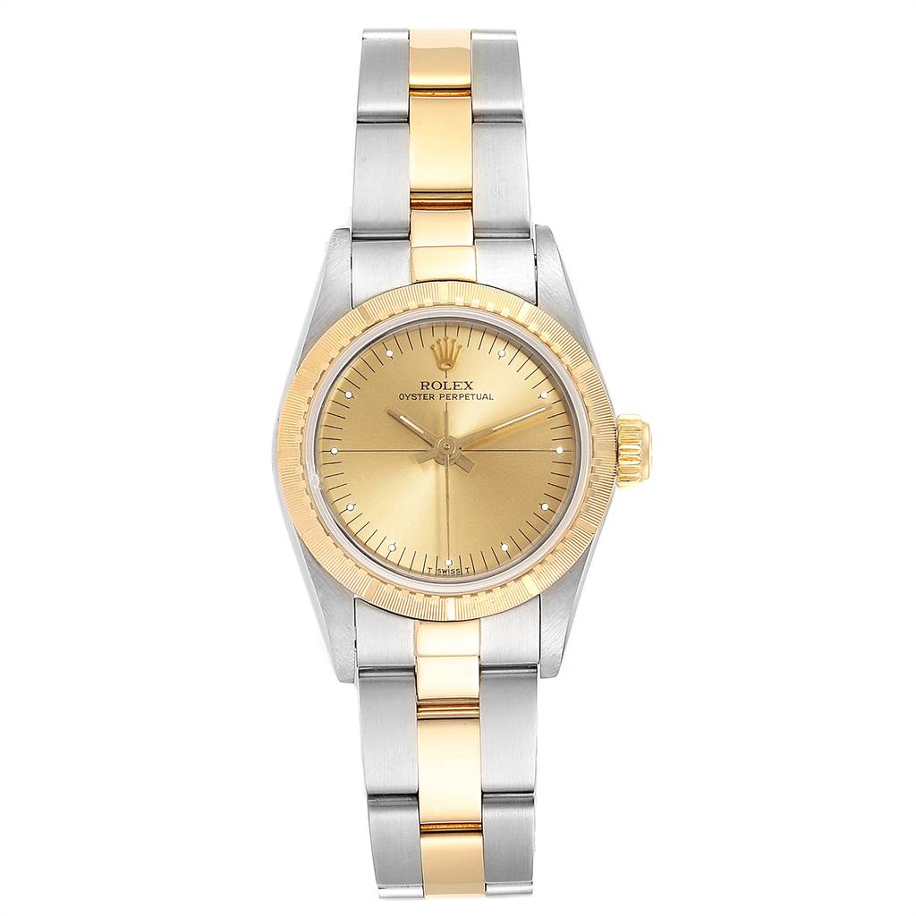 The image shows a front view of a Rolex Oyster Perpetual 67243 Women
s Steel and Gold (two tone) Champagne Dial 67243 Women
s Steel and Gold (two tone) Champagne Dial watch with a gold and silver bracelet and gold face.