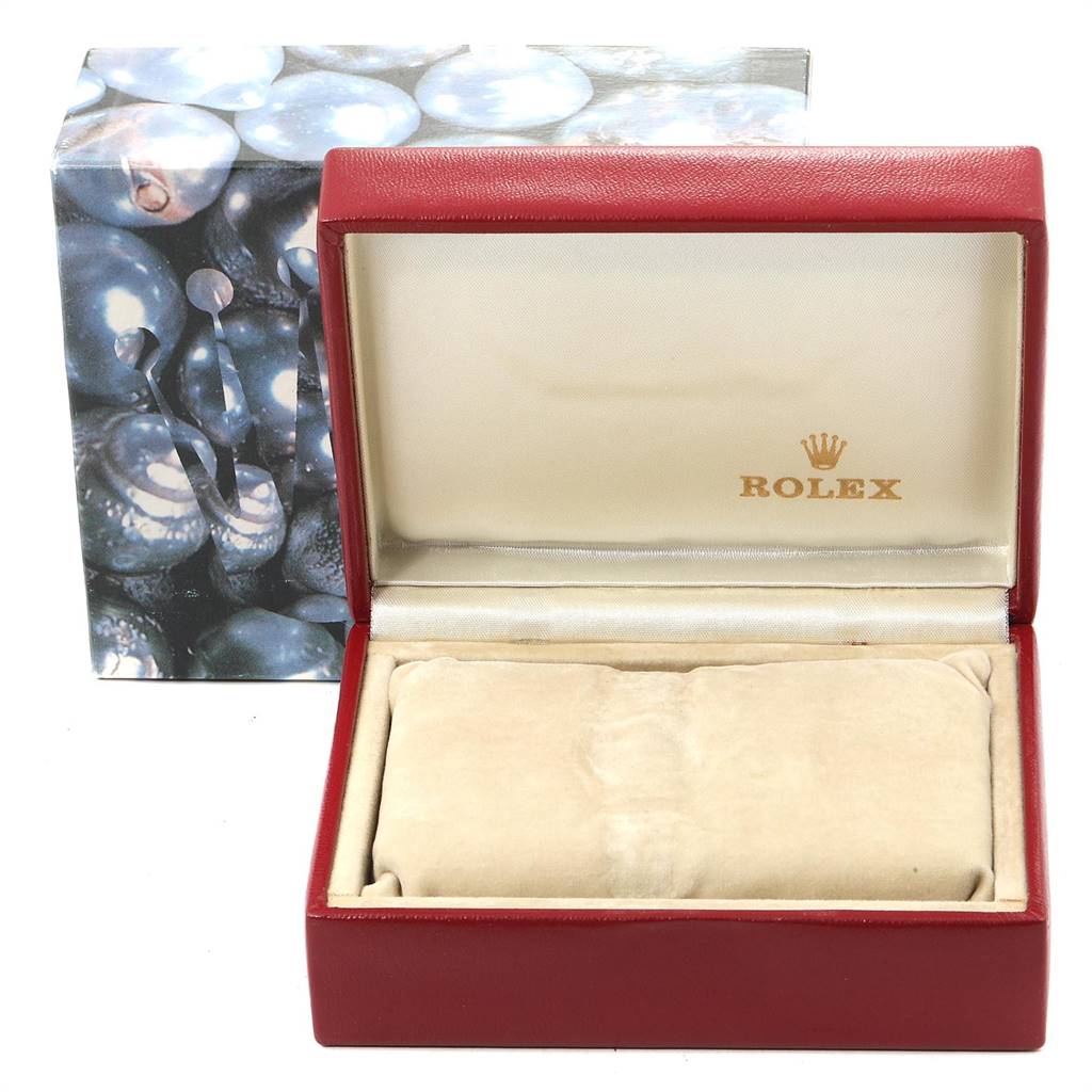 The image shows an open Rolex Oyster Perpetual 67193 Women
s Steel and Gold (two tone) Champagne Dial 67193 Women
s Steel and Gold (two tone) Champagne Dial watch box with the brand logo inside the lid and a cushioned insert, alongside the outer packaging.