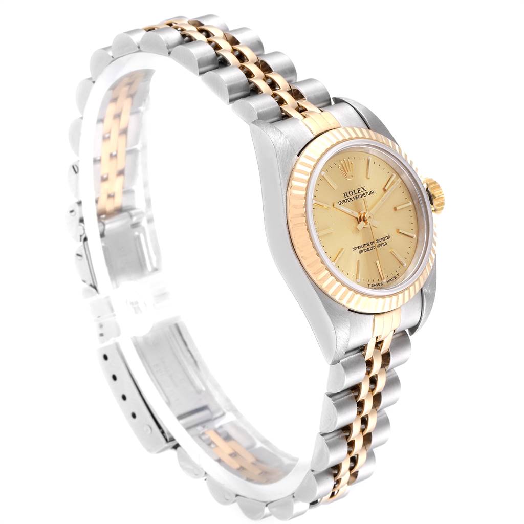 This image shows a Rolex Oyster Perpetual 67193 Women
s Steel and Gold (two tone) Champagne Dial 67193 Women
s Steel and Gold (two tone) Champagne Dial watch at a three-quarter angle, highlighting its dial, bezel, and two-tone bracelet.