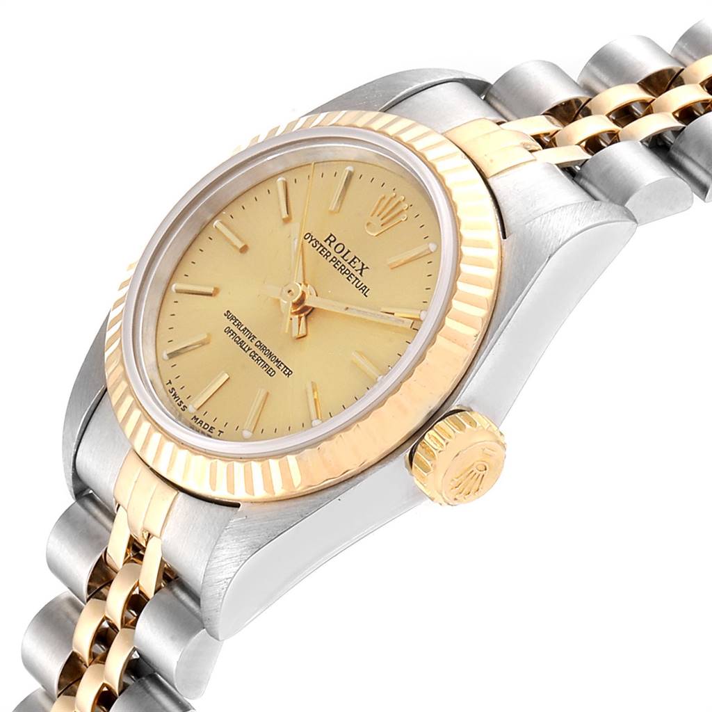 The Rolex Oyster Perpetual 67193 Women
s Steel and Gold (two tone) Champagne Dial 67193 Women
s Steel and Gold (two tone) Champagne Dial watch is shown from a side angle, highlighting the crown, bezel, and part of the bracelet.
