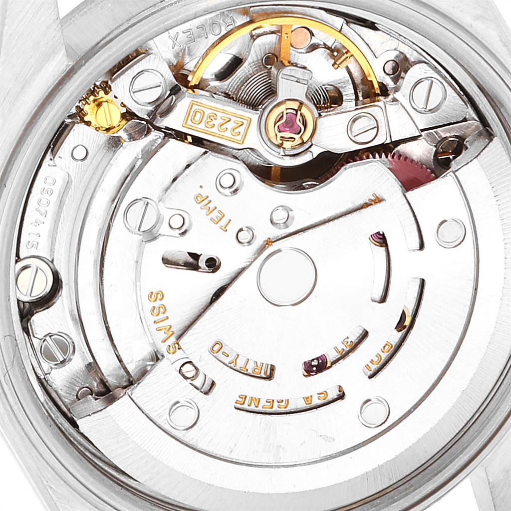 This image shows the internal mechanism of a Rolex Oyster Perpetual 67180 Women's Stainless Steel Pink Dial 67180 Women's Stainless Steel Pink Dial watch from a close-up, rear view angle, highlighting the movement components.