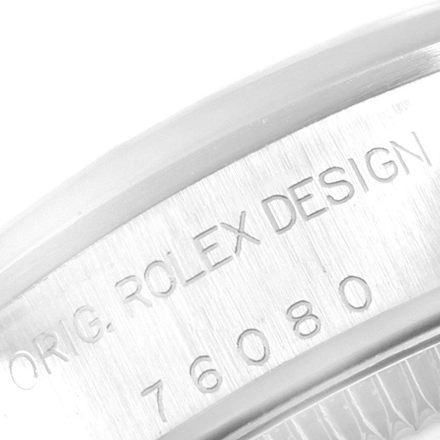 This image shows the engraved side of the bezel or casing for the Rolex Oyster Perpetual 67180 Women's Stainless Steel Pink Dial 67180 Women's Stainless Steel Pink Dial watch, displaying the model number.