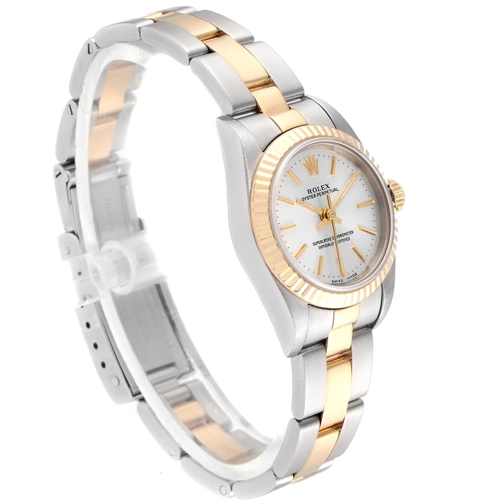 This image shows the side and front angle of a Rolex Oyster Perpetual 76193 Women's Steel and Gold (two tone) Silver Dial 76193 Women's Steel and Gold (two tone) Silver Dial watch, highlighting its two-tone bracelet and fluted bezel.