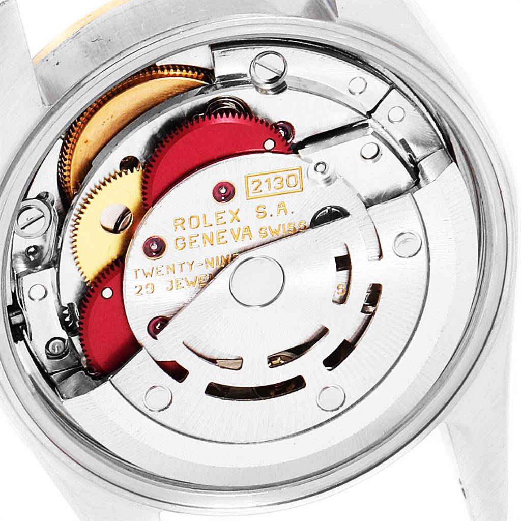This image shows the internal mechanical movement of a Rolex Oyster Perpetual 67183 Women
s Steel and Gold (two tone) Champagne Dial 67183 Women
s Steel and Gold (two tone) Champagne Dial watch, viewed from the back.