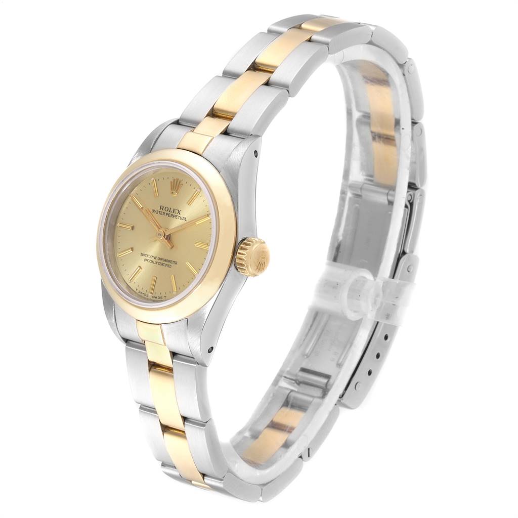The image shows a Rolex Oyster Perpetual 67183 Women
s Steel and Gold (two tone) Champagne Dial 67183 Women
s Steel and Gold (two tone) Champagne Dial watch at a three-quarter angle, highlighting its gold and silver bracelet and dial.