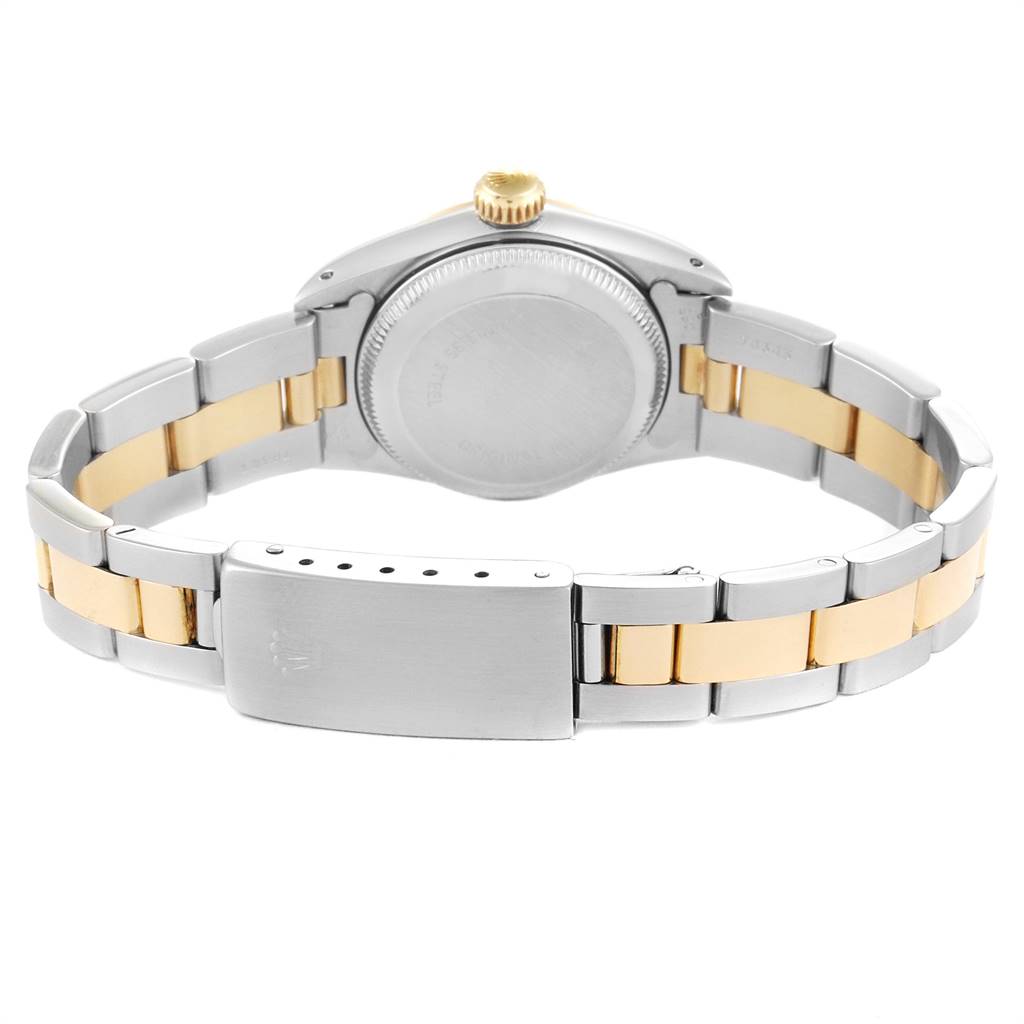 This image shows the back view of the Rolex Oyster Perpetual 67183 Women
s Steel and Gold (two tone) Champagne Dial 67183 Women
s Steel and Gold (two tone) Champagne Dial watch, featuring its two-tone metal bracelet and clasp.