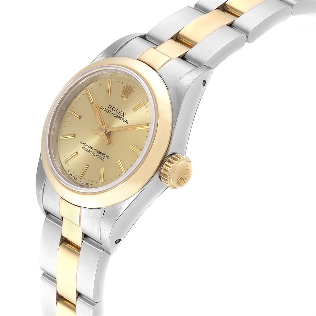 The image shows a close-up, angled view of a Rolex Oyster Perpetual 67183 Women
s Steel and Gold (two tone) Champagne Dial 67183 Women
s Steel and Gold (two tone) Champagne Dial watch, highlighting the dial, bezel, crown, and part of the bracelet.