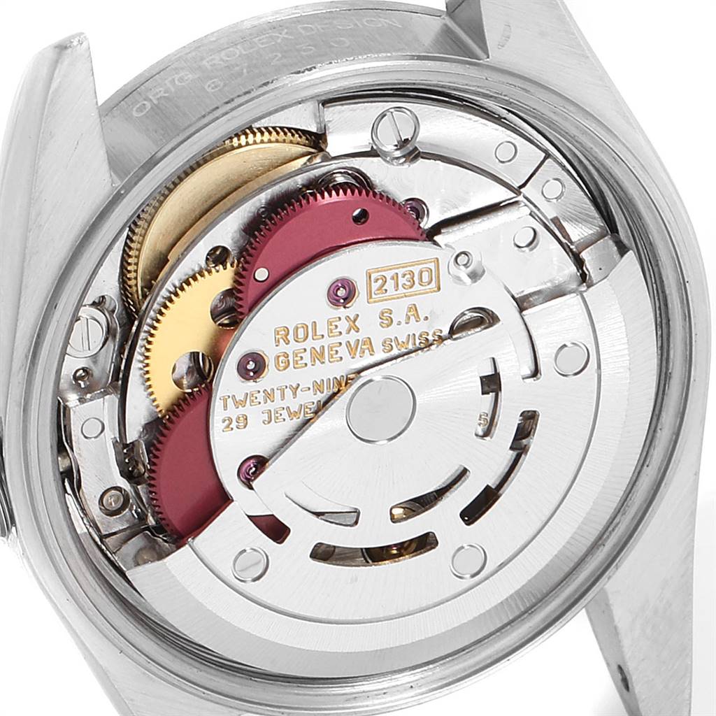 This image shows the movement mechanism of a Rolex Oyster Perpetual 67230 Women's Stainless Steel Pink Dial 67230 Women's Stainless Steel Pink Dial watch, highlighting its internal components from the back.