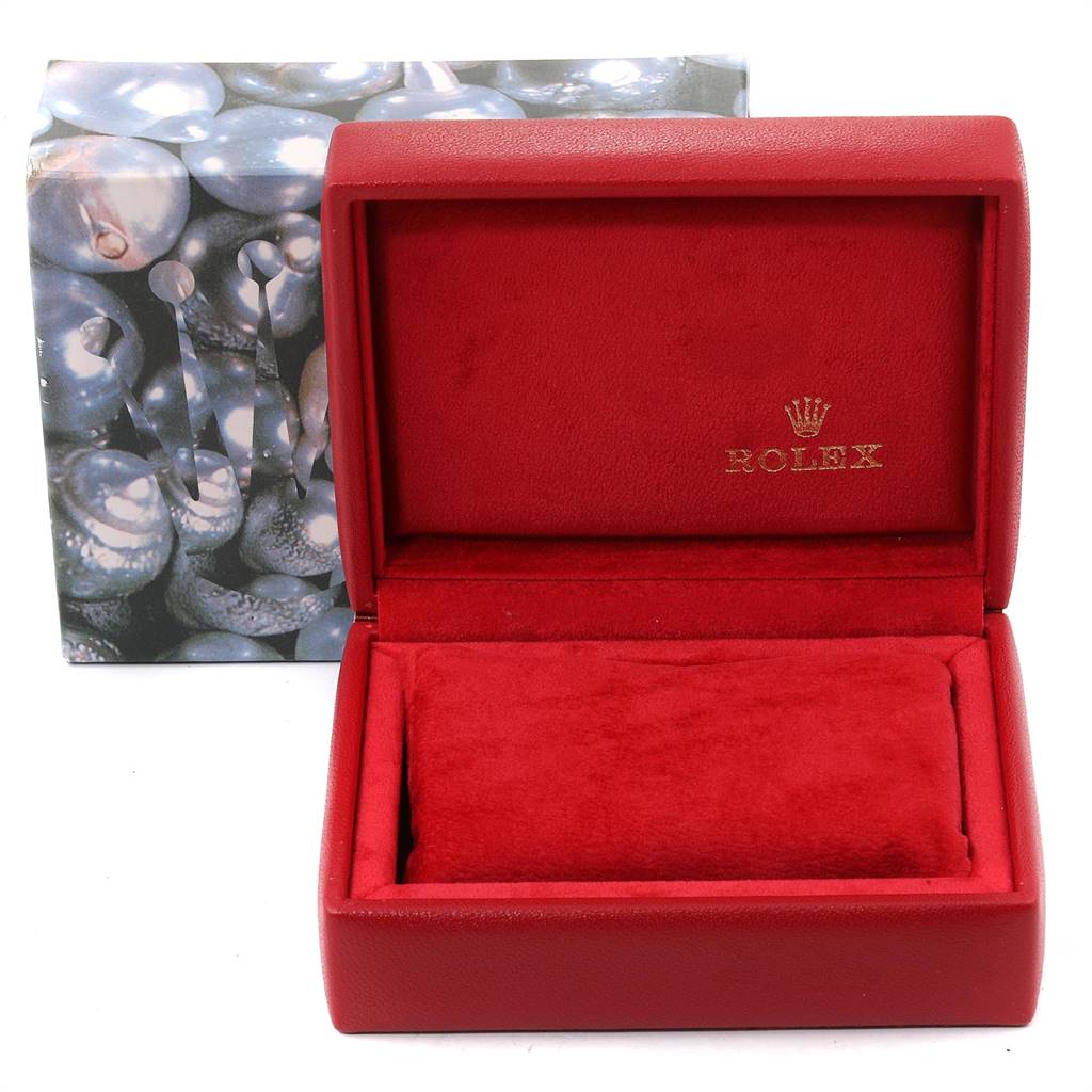 The image shows the empty red velvet-lined box for an Oyster Perpetual model by Rolex, with the brand's logo visible inside the box.