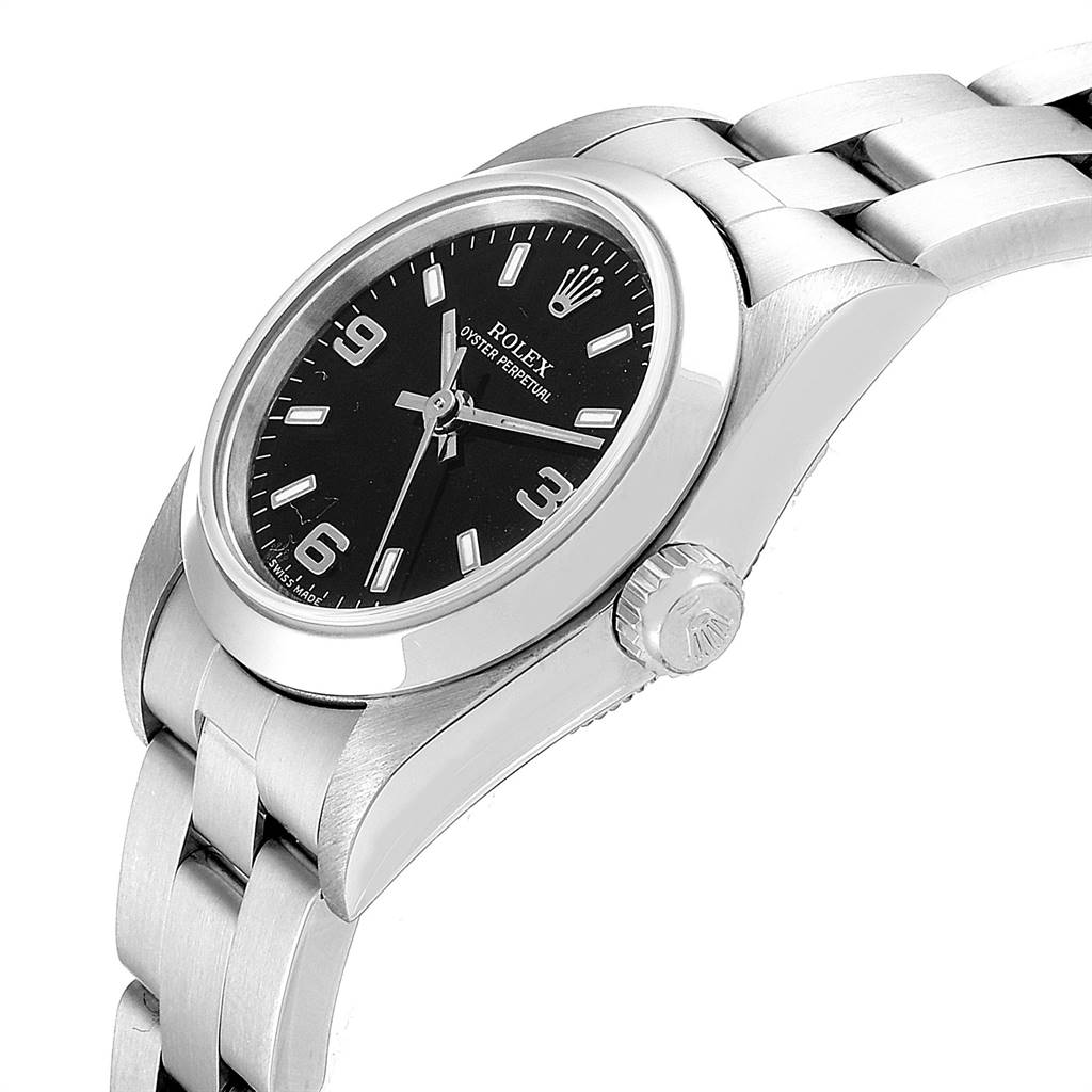This image shows an angled view of the Rolex Oyster Perpetual 76080 Women's Stainless Steel Black Dial 76080 Women's Stainless Steel Black Dial watch highlighting the face, crown, and part of the bracelet.