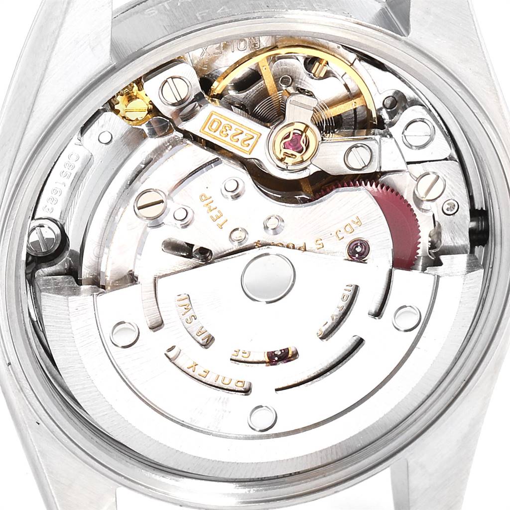 The image shows a close-up view of the movement and internal mechanism of a Rolex Oyster Perpetual 76080 Women's Stainless Steel Black Dial 76080 Women's Stainless Steel Black Dial watch.