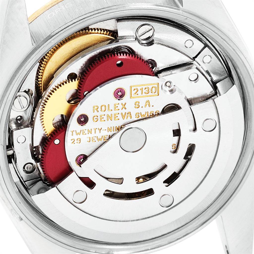 This image shows the intricate internal mechanism of the Rolex Oyster Perpetual 67183 Women
s Steel and Gold (two tone) Champagne Dial 67183 Women
s Steel and Gold (two tone) Champagne Dial watch from a top-down angle.