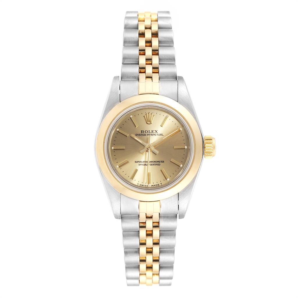 This image shows a front-facing view of a Rolex Oyster Perpetual 67183 Women
s Steel and Gold (two tone) Champagne Dial 67183 Women
s Steel and Gold (two tone) Champagne Dial watch with a gold and silver bracelet.