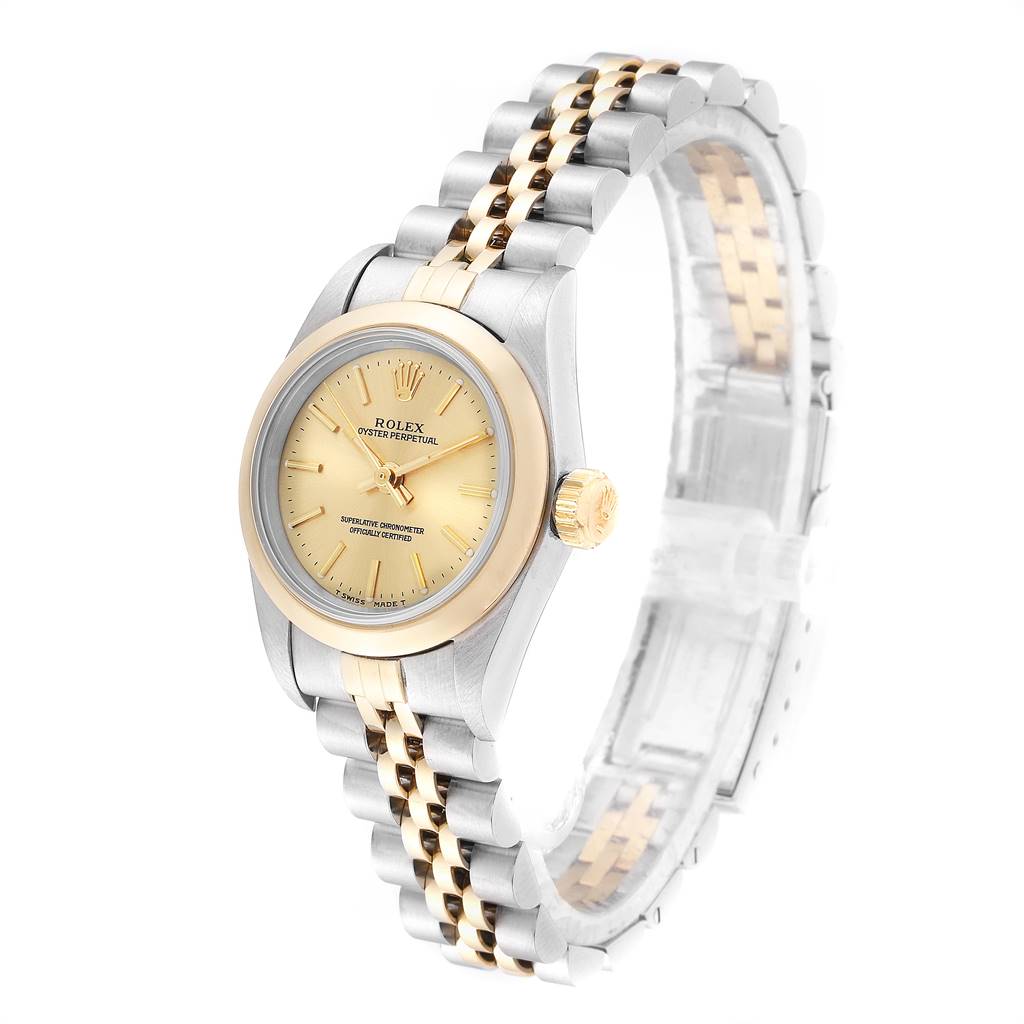 This Rolex Oyster Perpetual 67183 Women
s Steel and Gold (two tone) Champagne Dial 67183 Women
s Steel and Gold (two tone) Champagne Dial watch is shown at a slight angle, displaying the watch face, case, crown, and bracelet.