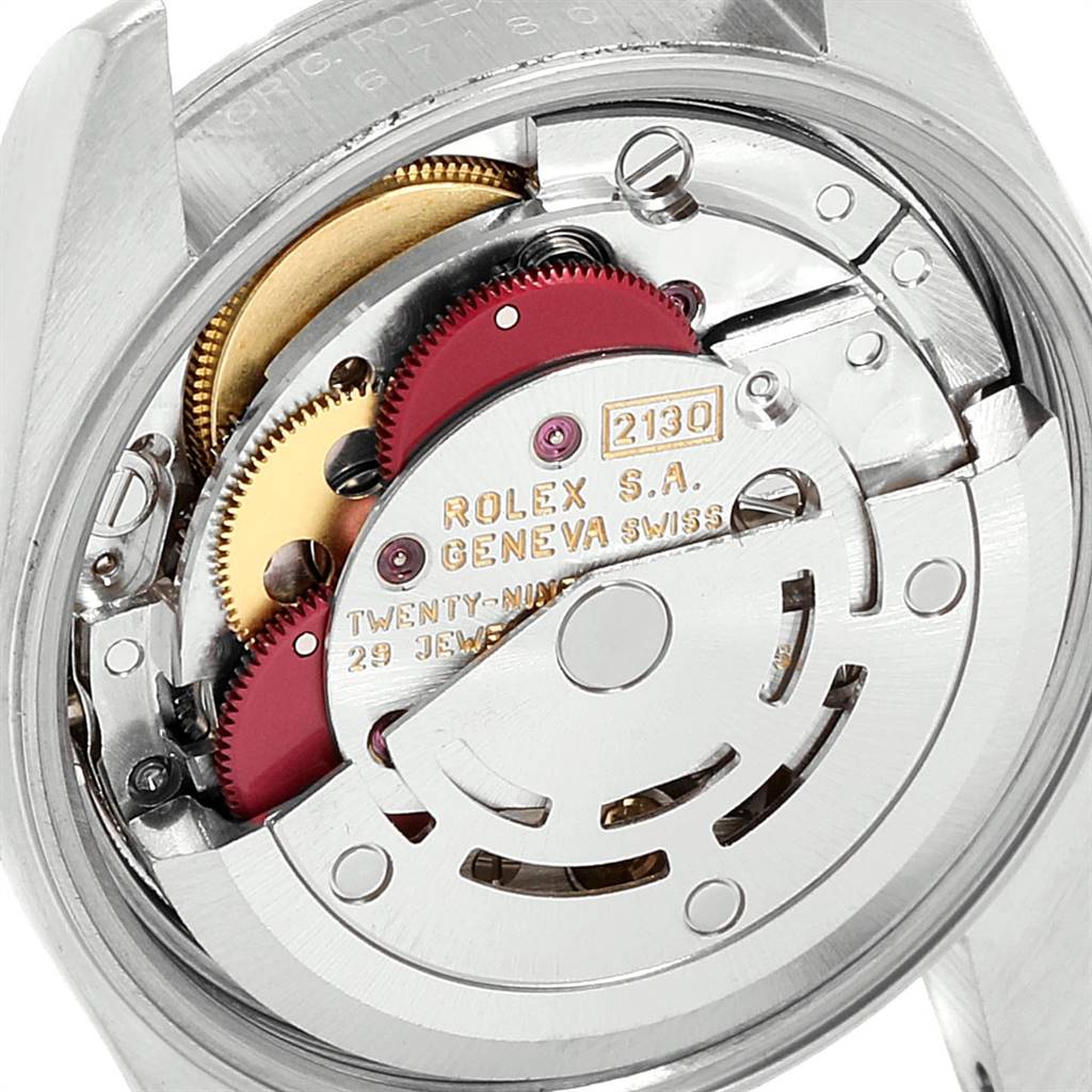 This image showcases the movement mechanism of the Rolex Oyster Perpetual 67180 Women's Stainless Steel Silver Dial 67180 Women's Stainless Steel Silver Dial watch from a rear angle.