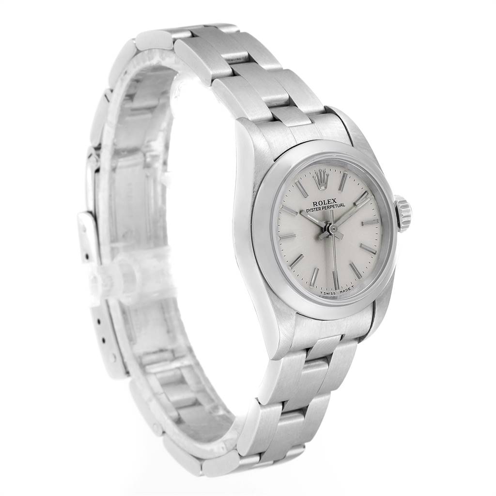The image shows a side angle of the Rolex Oyster Perpetual 67180 Women's Stainless Steel Silver Dial 67180 Women's Stainless Steel Silver Dial watch, displaying its face, bezel, and bracelet.