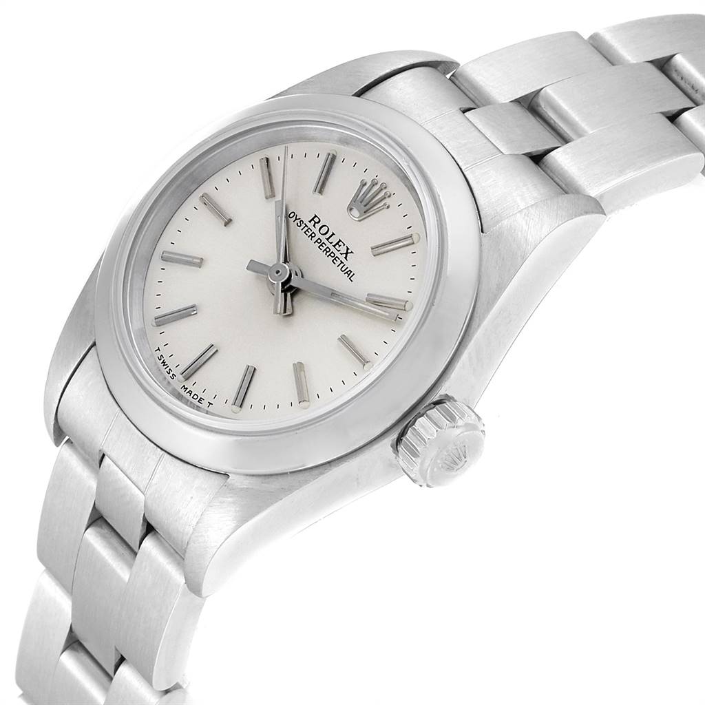 The image shows a close-up side angle of the Rolex Oyster Perpetual 67180 Women's Stainless Steel Silver Dial 67180 Women's Stainless Steel Silver Dial watch, featuring the dial, bezel, and part of the bracelet.