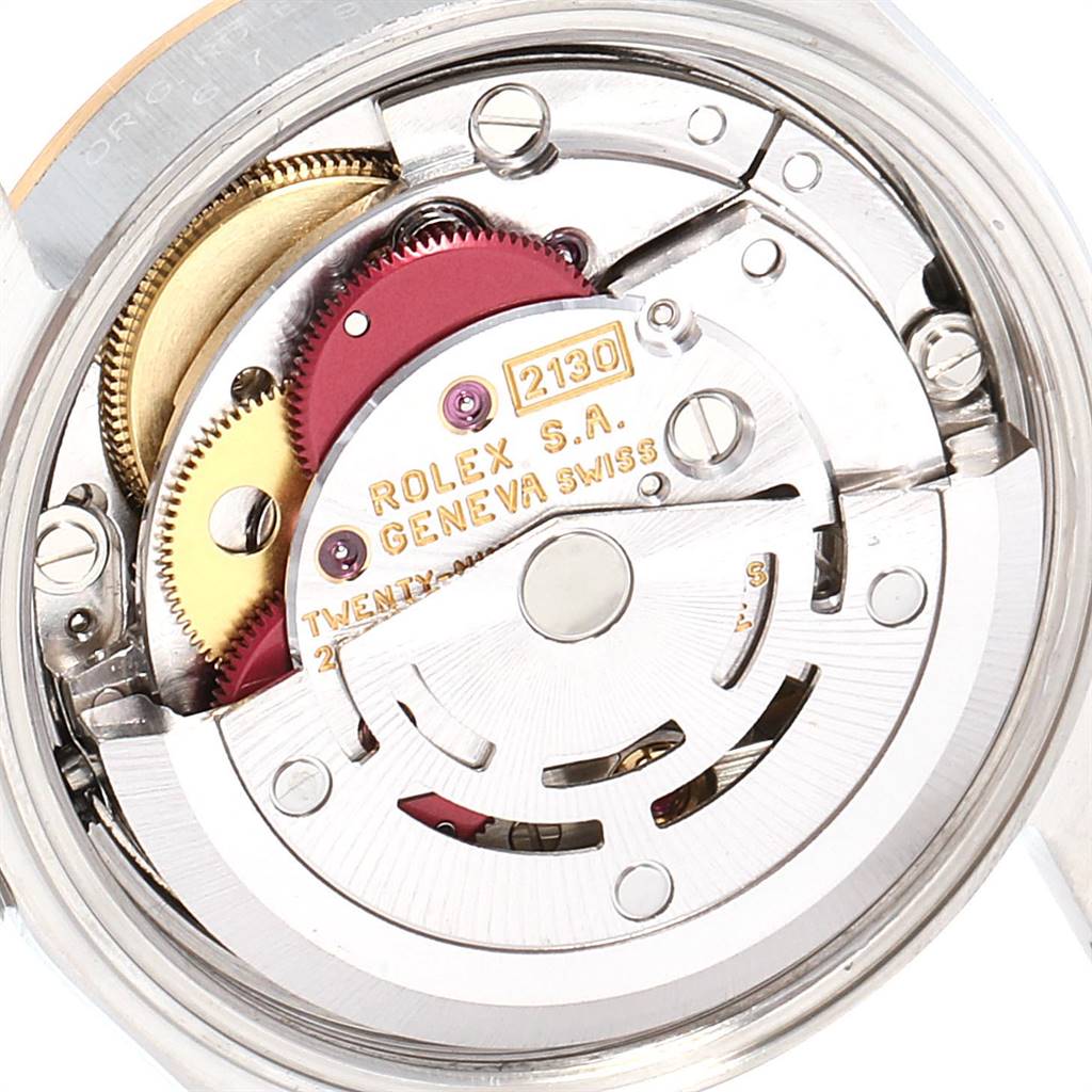 This image shows the internal mechanical movement of a Rolex Oyster Perpetual 67193 Women
s Steel and Gold (two tone) White Dial 67193 Women
s Steel and Gold (two tone) White Dial model, highlighting gears and the rotor.
