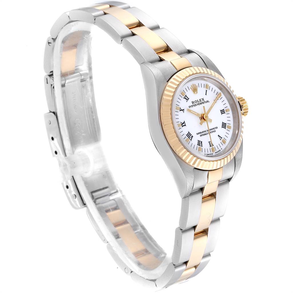 This image shows a side angle of a Rolex Oyster Perpetual 67193 Women
s Steel and Gold (two tone) White Dial 67193 Women
s Steel and Gold (two tone) White Dial watch, highlighting the two-tone strap, white dial, and fluted bezel.