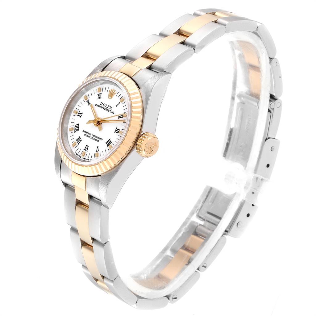 This image shows a Rolex Oyster Perpetual 67193 Women
s Steel and Gold (two tone) White Dial 67193 Women
s Steel and Gold (two tone) White Dial watch from a side angle, featuring the dial, crown, bezel, and bracelet.