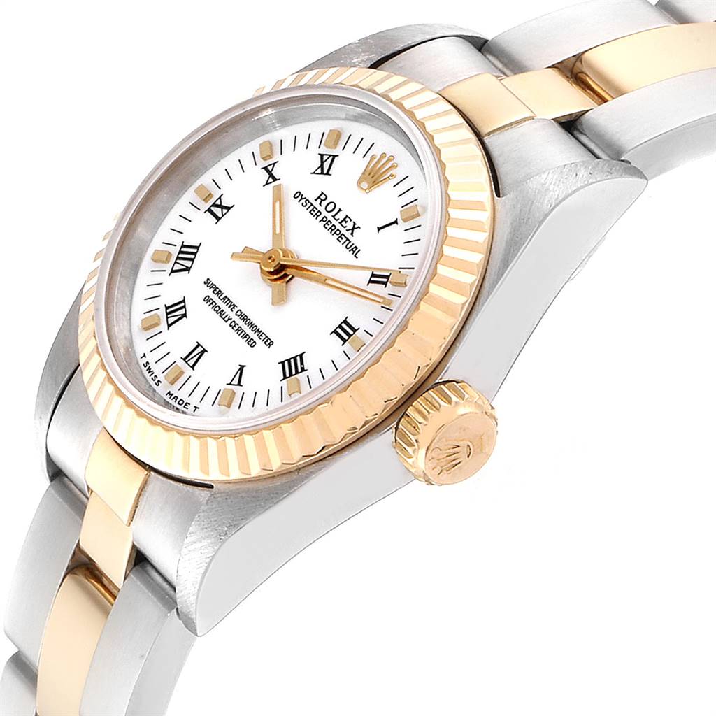 The image shows a tilted side view of the Rolex Oyster Perpetual 67193 Women
s Steel and Gold (two tone) White Dial 67193 Women
s Steel and Gold (two tone) White Dial watch, focusing on the dial, bezel, crown, and part of the bracelet.
