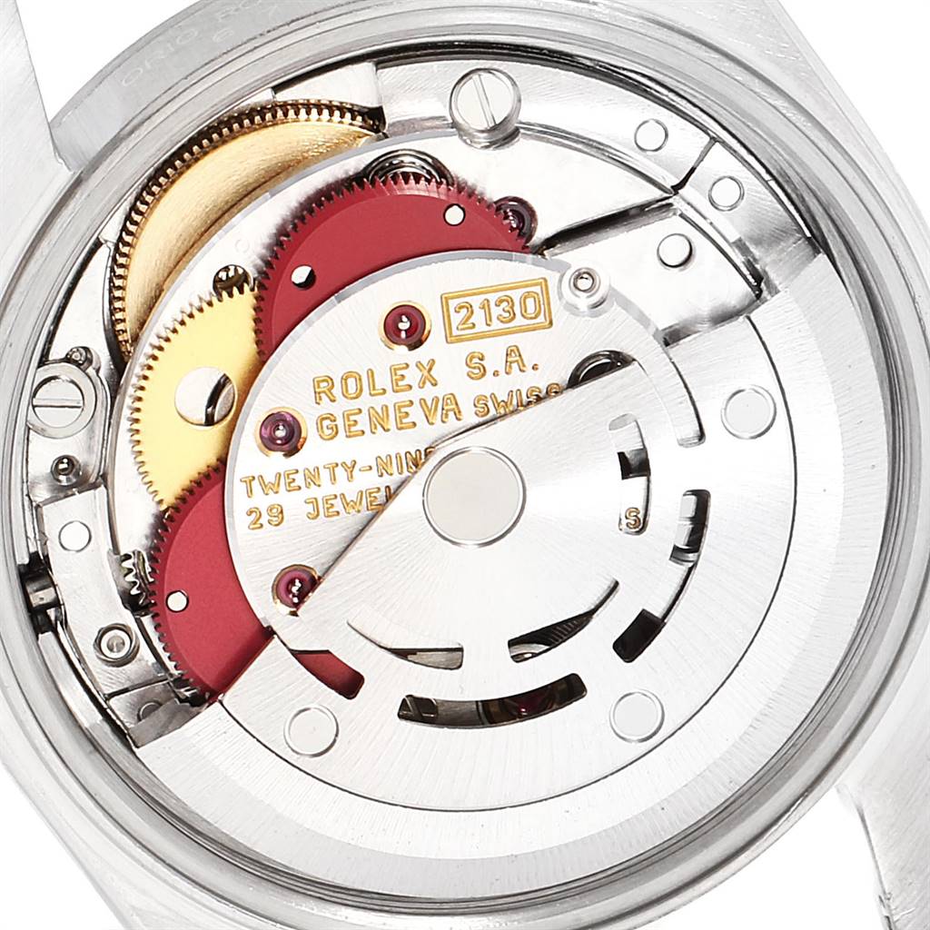 This image shows the Rolex Oyster Perpetual 67180 Women
s Stainless Steel Blue Dial 67180 Women
s Stainless Steel Blue Dial
s movement and internal components from a close-up, rear angle.