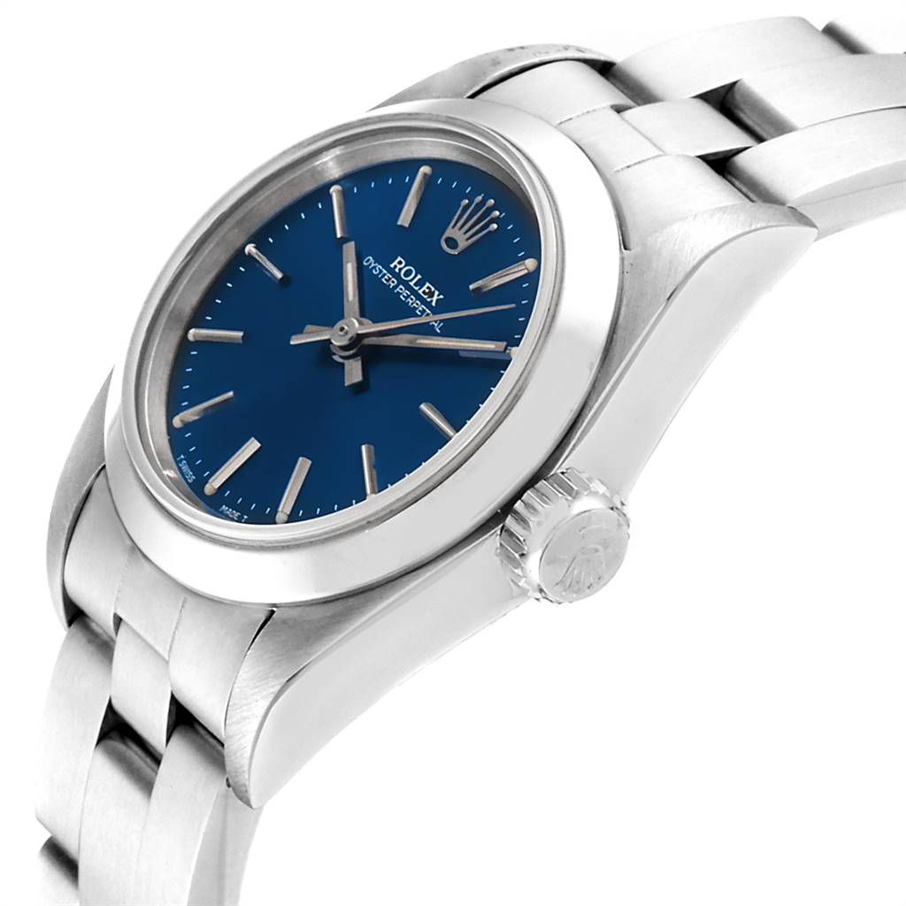 The image shows a side view of a Rolex Oyster Perpetual 67180 Women
s Stainless Steel Blue Dial 67180 Women
s Stainless Steel Blue Dial watch highlighting the watch face, crown, and part of the bracelet.