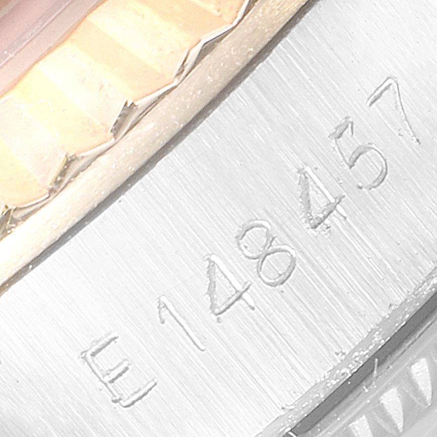 The image shows a close-up of the serial number engraving on the case of a Rolex Oyster Perpetual 67193 Women's Steel and Gold (two tone) Silver Dial 67193 Women's Steel and Gold (two tone) Silver Dial watch.