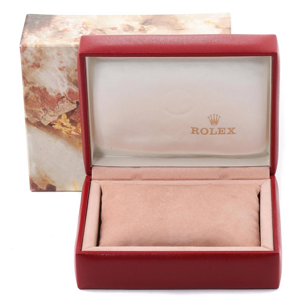 The image shows an empty Rolex watch box for the Oyster Perpetual model with a branded interior and an outer case.