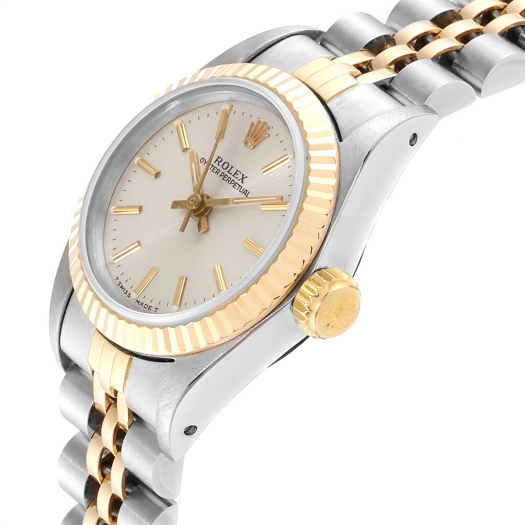 The image shows a side angle of the Rolex Oyster Perpetual 67193 Women's Steel and Gold (two tone) Silver Dial 67193 Women's Steel and Gold (two tone) Silver Dial watch, highlighting the bezel, dial, crown, and part of the bracelet.
