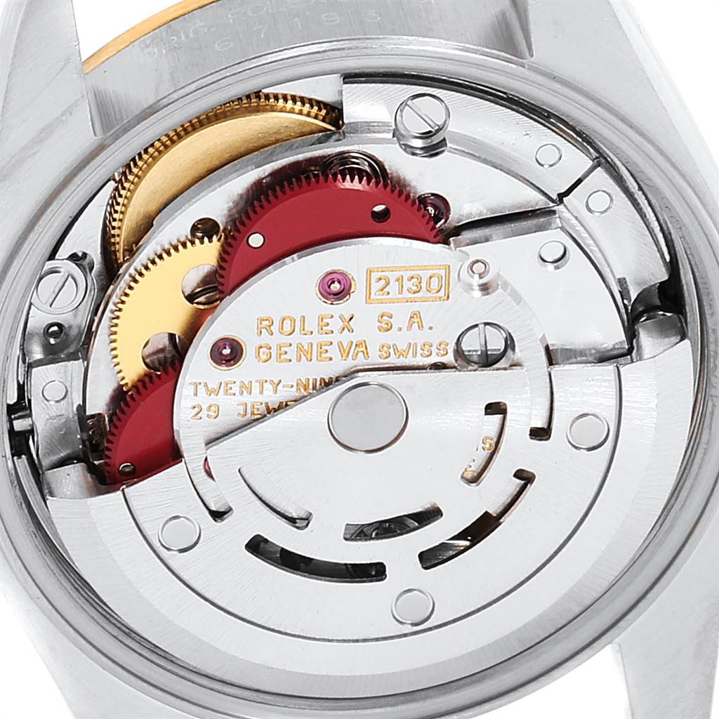 The image shows the internal mechanism and movement parts of a Rolex Oyster Perpetual 67193 Women
s Steel and Gold (two tone) Champagne Dial 67193 Women
s Steel and Gold (two tone) Champagne Dial watch.