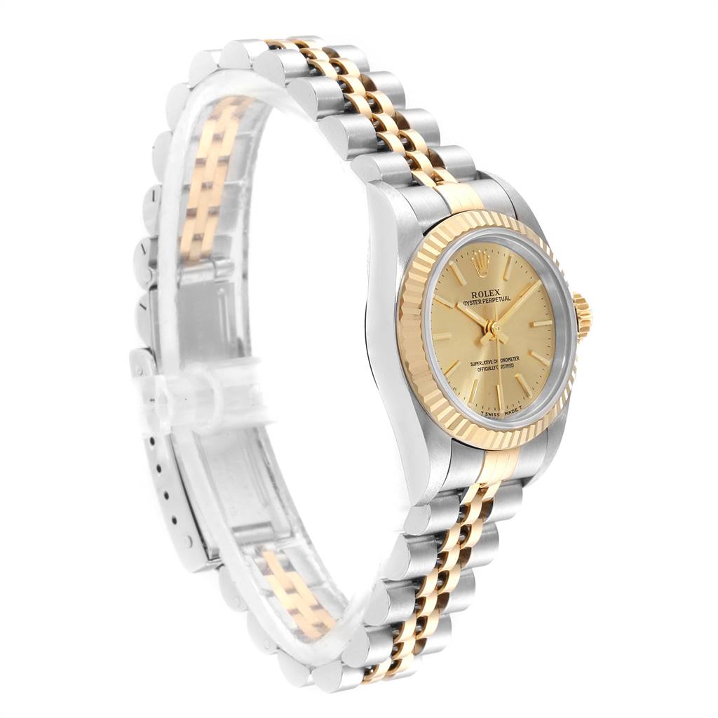The Rolex Oyster Perpetual 67193 Women
s Steel and Gold (two tone) Champagne Dial 67193 Women
s Steel and Gold (two tone) Champagne Dial watch is shown from a side angle, highlighting the bezel, crown, dial, and part of its bracelet.